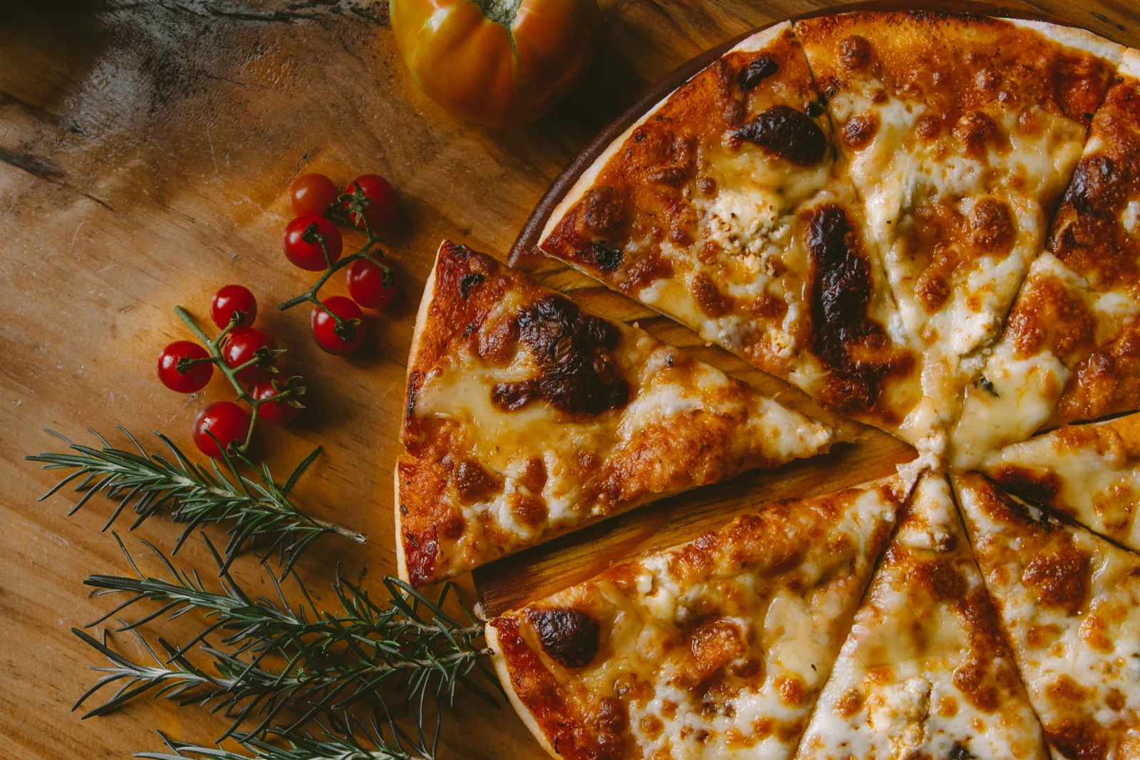 Crustique Web signature pizza fresh from the wood-fired oven with fire-kissed crust and premium toppings